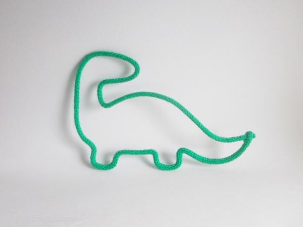 dinosaure tricotin vert