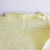 poncho bebe jaune boutonne